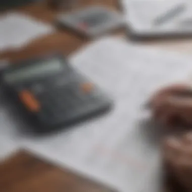 A calculator and financial documents on a table