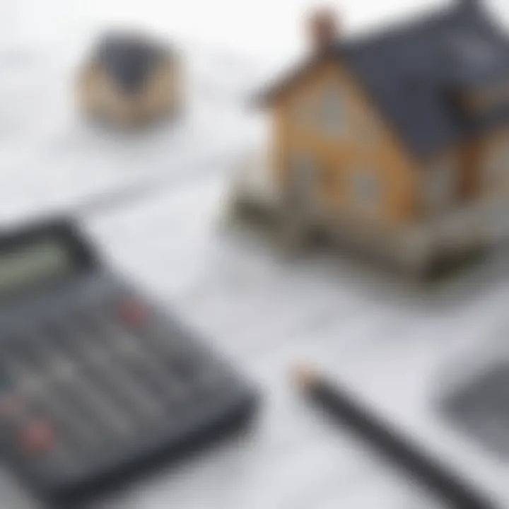 A close-up of loan documents with a calculator and a house model